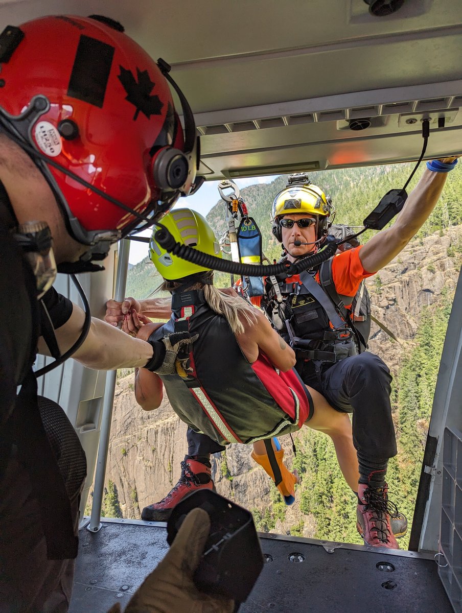 Hoist Rescue Dr. Brown and Subject Getting into Helicopter
